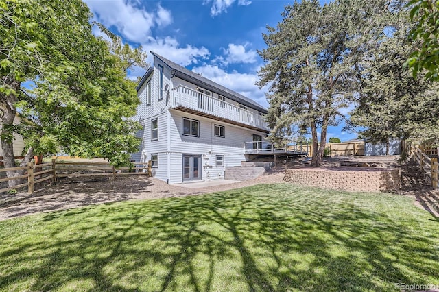 7792 Garrison Ct, Arvada, CO 80005 - back of house with french doors, a wooden deck, and a patio