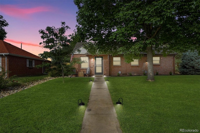 view of front of home with a yard