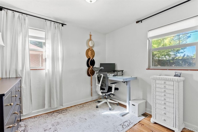 office area featuring plenty of natural light and light wood-type flooring