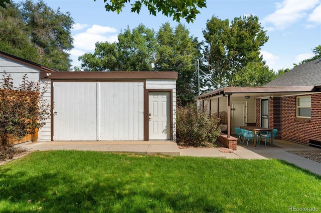 view of outbuilding with a yard