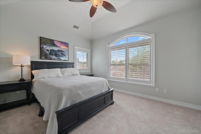 bedroom featuring light colored carpet, visible vents, vaulted ceiling, ceiling fan, and baseboards