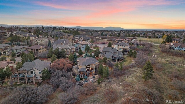 drone / aerial view featuring a mountain view and a residential view