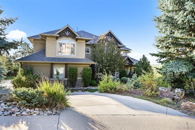 1159 Buffalo Ridge Rd, Castle Pines, CO 80108 - view of front of home with stucco siding and stone siding