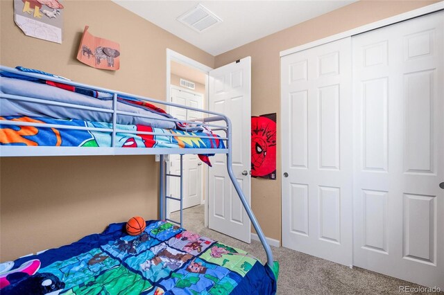 23584 E 5th Pl, Aurora, CO 80018 - unfurnished bedroom with carpet flooring, a closet, and visible vents