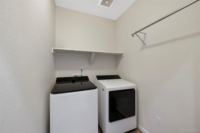 laundry room featuring laundry area, washer and dryer, and visible vents