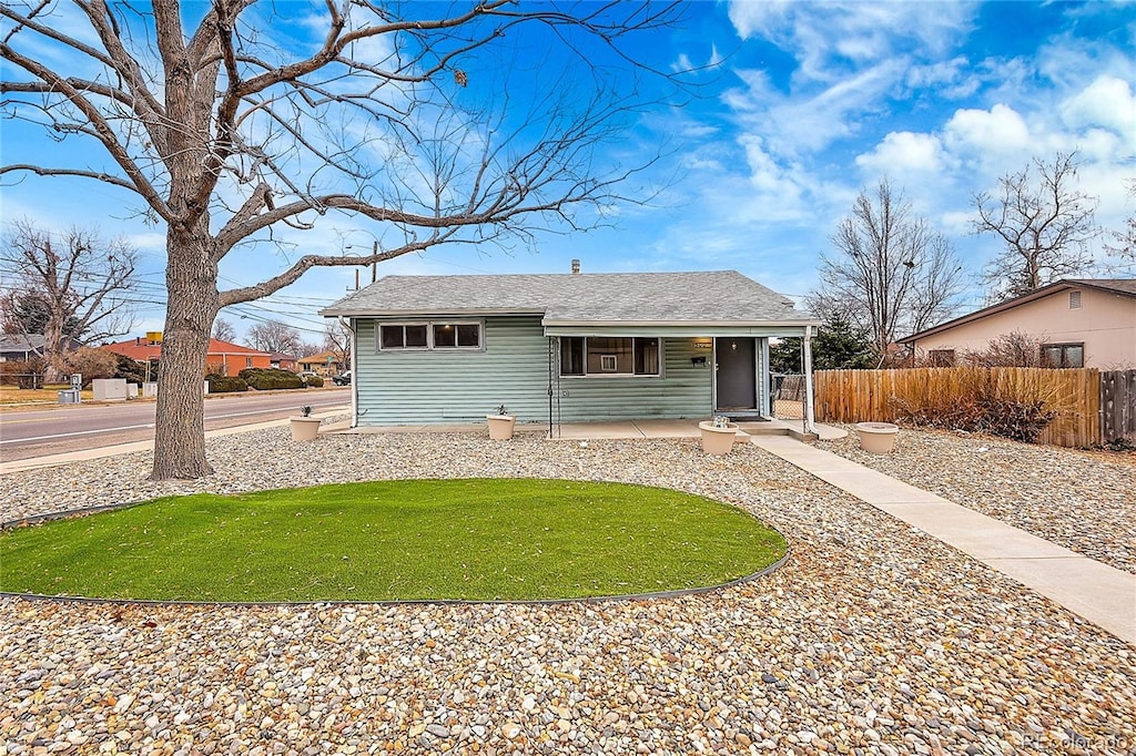 ranch-style home with a front yard