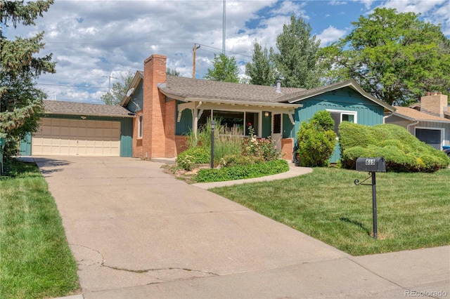 815 Hoyt St, Lakewood, CO 80215 - single story home with a front yard, driveway, an attached garage, and a chimney
