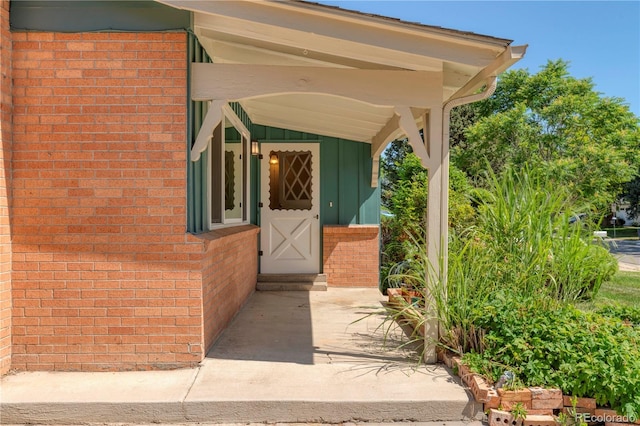 815 Hoyt St, Lakewood, CO 80215 - property entrance featuring brick siding and board and batten siding