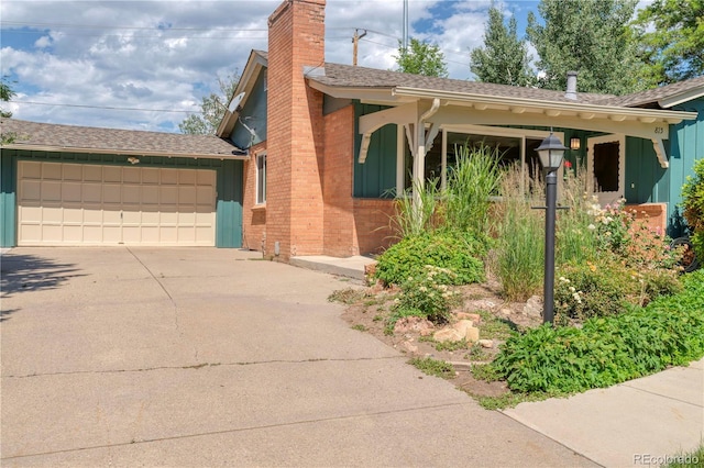 815 Hoyt St, Lakewood, CO 80215 - ranch-style home featuring a chimney, roof with shingles, an attached garage, and board and batten siding