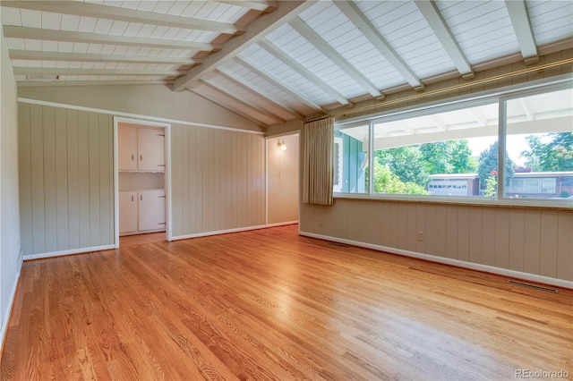 815 Hoyt St, Lakewood, CO 80215 - empty room with wood finished floors and wooden walls