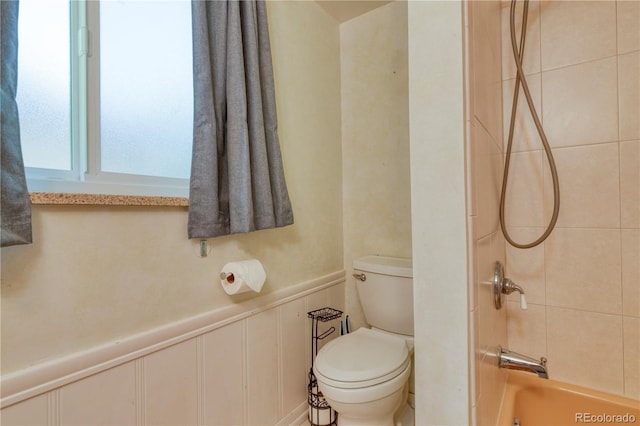815 Hoyt St, Lakewood, CO 80215 - bathroom featuring bathtub / shower combination and wainscoting