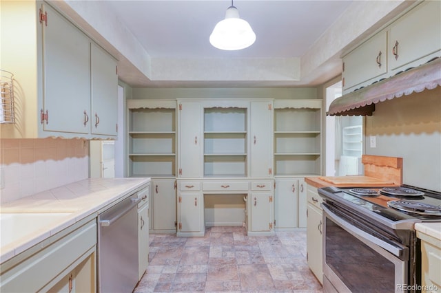 815 Hoyt St, Lakewood, CO 80215 - kitchen featuring open shelves, appliances with stainless steel finishes, tile counters, backsplash, and stone finish flooring