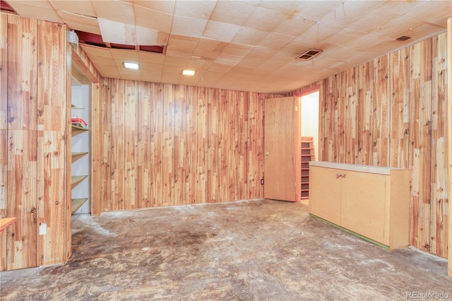 815 Hoyt St, Lakewood, CO 80215 - unfurnished room with wooden walls and carpet flooring