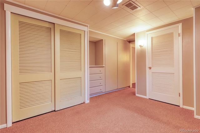 815 Hoyt St, Lakewood, CO 80215 - unfurnished bedroom with carpet, ornamental molding, and a closet