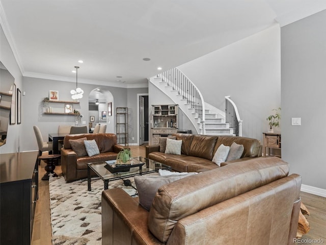 425 Steele St, Denver, CO 80206 - living area featuring stairway, light wood-type flooring, arched walkways, ornamental molding, and recessed lighting