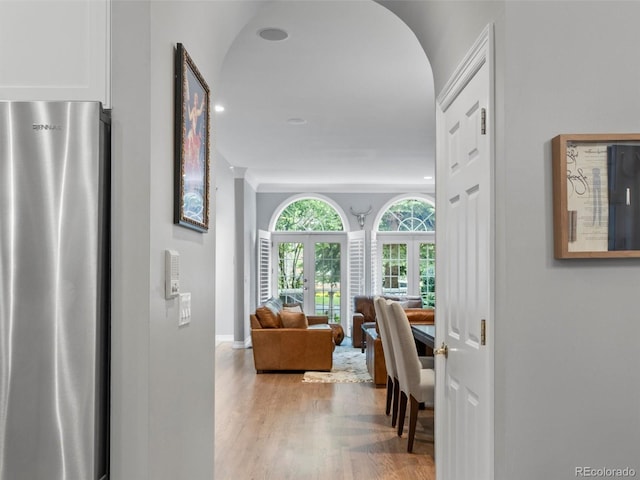 425 Steele St, Denver, CO 80206 - corridor featuring wood finished floors, arched walkways, and recessed lighting