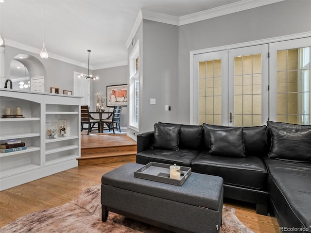 425 Steele St, Denver, CO 80206 - living area with wood finished floors, a chandelier, and ornamental molding