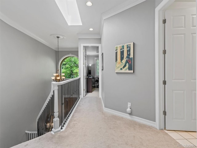 425 Steele St, Denver, CO 80206 - corridor featuring a skylight, an upstairs landing, crown molding, recessed lighting, and carpet flooring