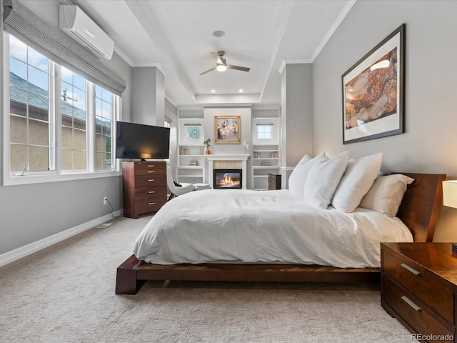 425 Steele St, Denver, CO 80206 - bedroom featuring a wall mounted AC, crown molding, carpet flooring, and a glass covered fireplace