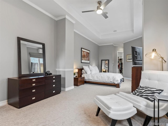 425 Steele St, Denver, CO 80206 - carpeted bedroom featuring a spacious closet, a tray ceiling, crown molding, a closet, and ceiling fan