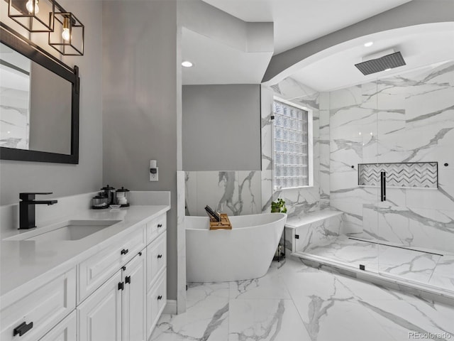425 Steele St, Denver, CO 80206 - bathroom with vanity, marble finish flooring, a freestanding tub, a marble finish shower, and recessed lighting