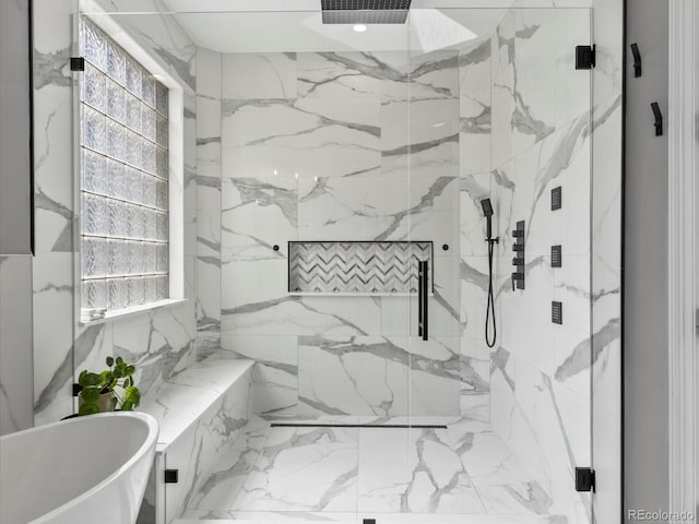 425 Steele St, Denver, CO 80206 - bathroom with a marble finish shower, a freestanding tub, and marble finish floors