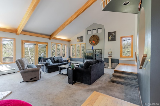 living area with carpet flooring, beamed ceiling, and high vaulted ceiling