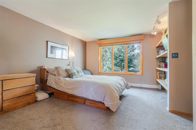 carpeted bedroom featuring a baseboard radiator