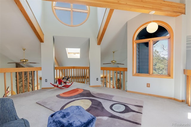 living room with carpet flooring, a ceiling fan, beamed ceiling, and high vaulted ceiling
