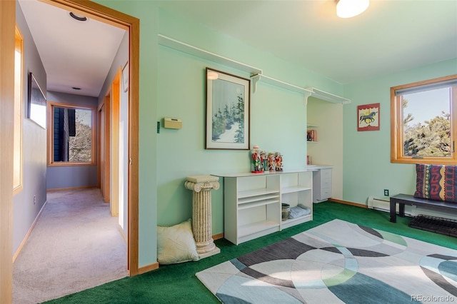 interior space featuring carpet and baseboards