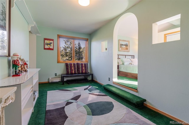 interior space featuring arched walkways, baseboards, baseboard heating, and dark carpet