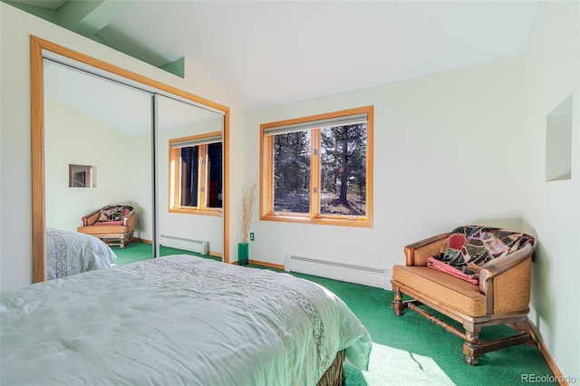 carpeted bedroom featuring a baseboard heating unit, baseboards, a closet, and vaulted ceiling