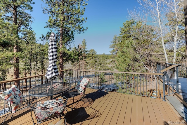 deck featuring outdoor dining area