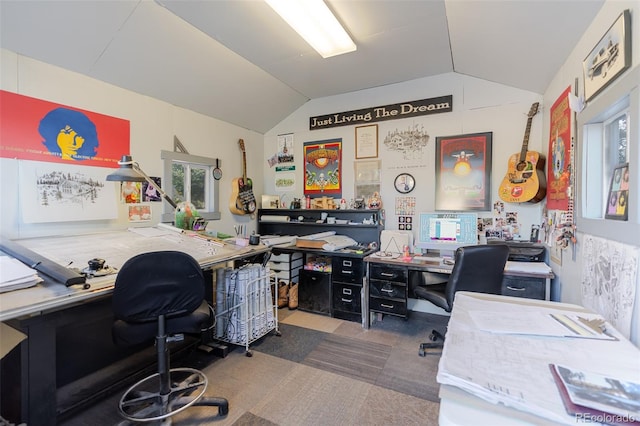 home office featuring lofted ceiling and carpet floors