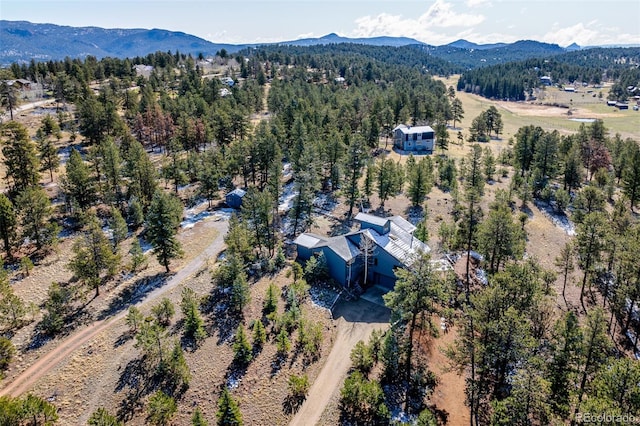 birds eye view of property with a mountain view