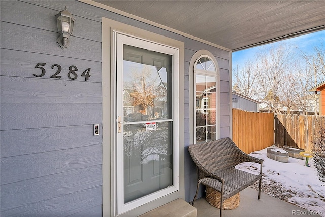 view of snow covered property entrance