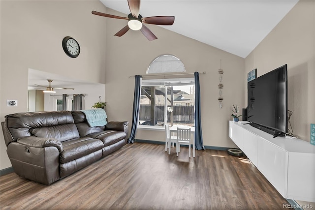 living room featuring ceiling fan, dark hardwood / wood-style flooring, and high vaulted ceiling