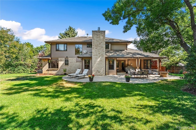 back of house with a lawn, cooling unit, and a patio area