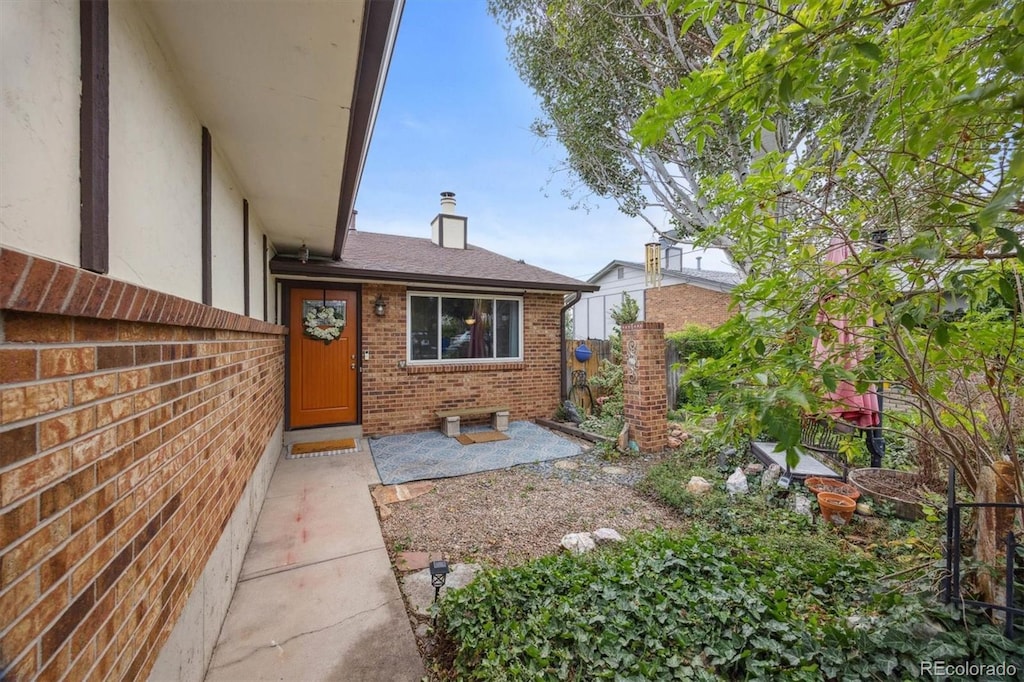 entrance to property with a patio area