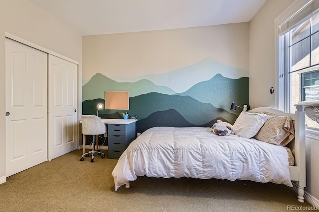 bedroom with carpet floors, a closet, and baseboards