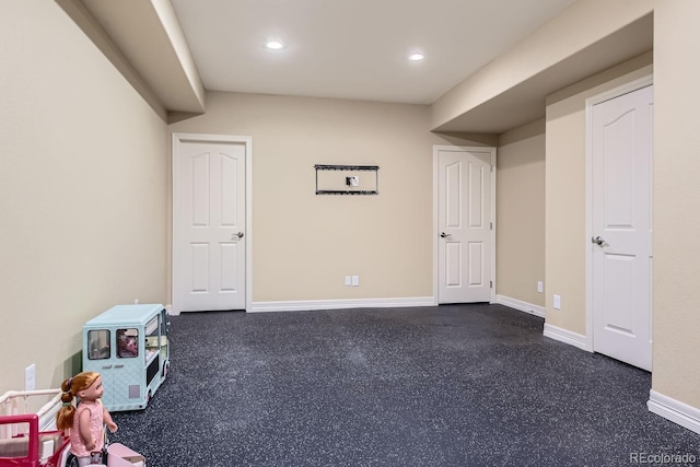 interior space featuring recessed lighting and baseboards