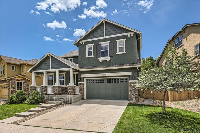 10935 Valleybrook Cir, Highlands Ranch, CO 80130 - craftsman-style home with stone siding, stucco siding, covered porch, concrete driveway, and an attached garage