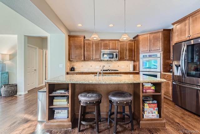 10935 Valleybrook Cir, Highlands Ranch, CO 80130 - kitchen featuring open shelves, appliances with stainless steel finishes, a kitchen island with sink, backsplash, and recessed lighting