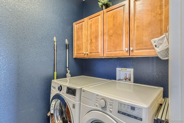 10935 Valleybrook Cir, Highlands Ranch, CO 80130 - laundry area featuring cabinet space, washing machine and dryer, and a textured wall