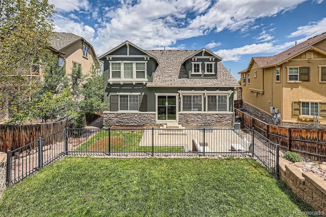 10935 Valleybrook Cir, Highlands Ranch, CO 80130 - rear view of house with stone siding, roof with shingles, and stucco siding