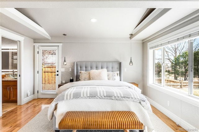 bedroom featuring light wood finished floors, access to outside, and baseboards