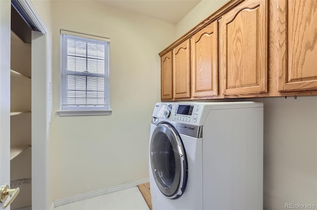 laundry room with washer / dryer and cabinet space