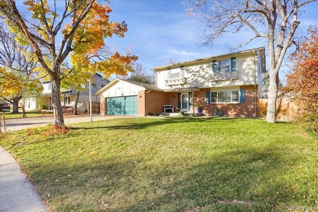 view of front of home with a front lawn and a garage