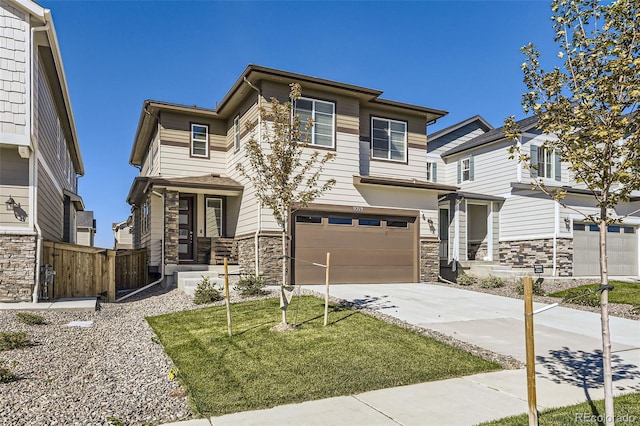 view of front facade featuring a front yard and a garage