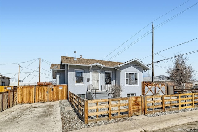 view of front of property featuring a fenced front yard and stucco siding